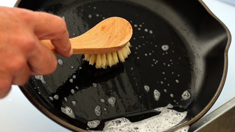 Scrubbing a cast iron pan