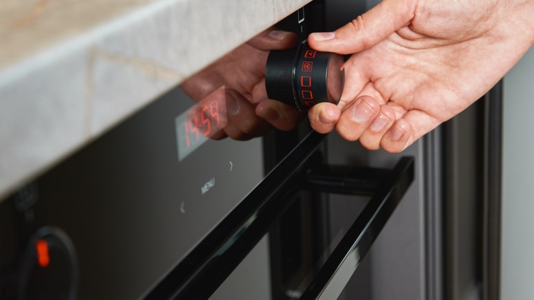 Hand preheating an oven