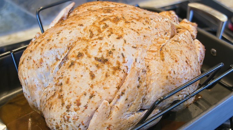 dry brined turkey in roasting pan