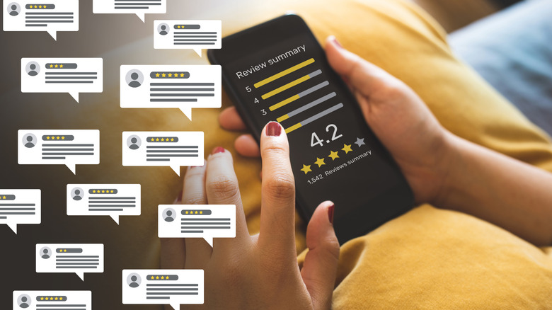 Multiple reviews with person holding phone