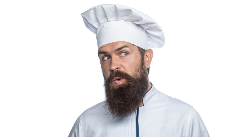 Bearded chef on white background