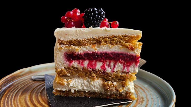 slice of cheescake and cake hybrid on a beige plate