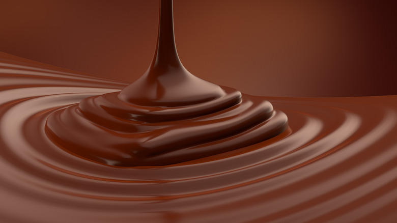 Liquid chocolate drizzling down into concentric rings