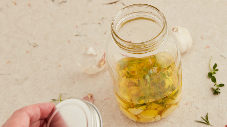 Confit garlic in jar