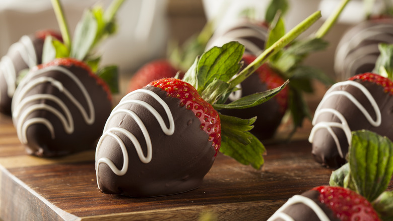 Close-up of chocolate-covered strawberries with white decorations