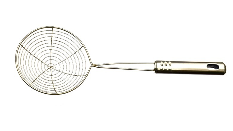 A wire spider skimmer used for cooking