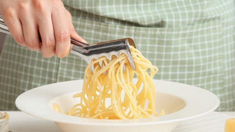 Pasta tongs plate spaghetti