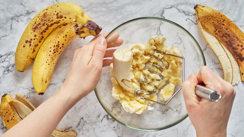 mashing bananas in bowl