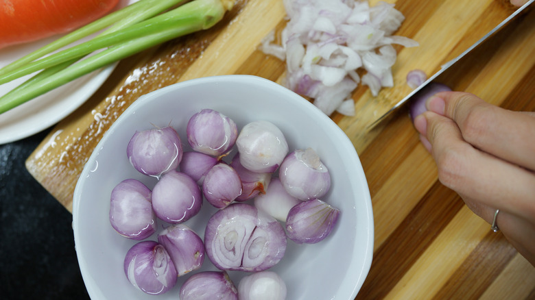 small onions soaking in water