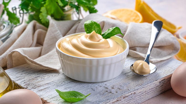 Mayo and ingredients on cutting board 