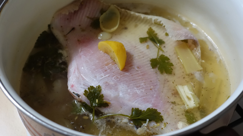 poaching fish in pot