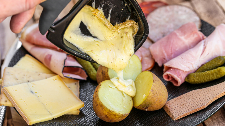 Melting raclette on potatoes