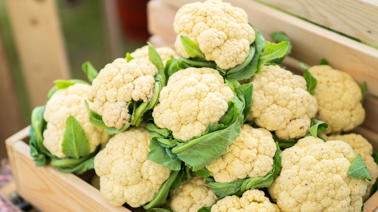 fresh cauliflower in wooden box