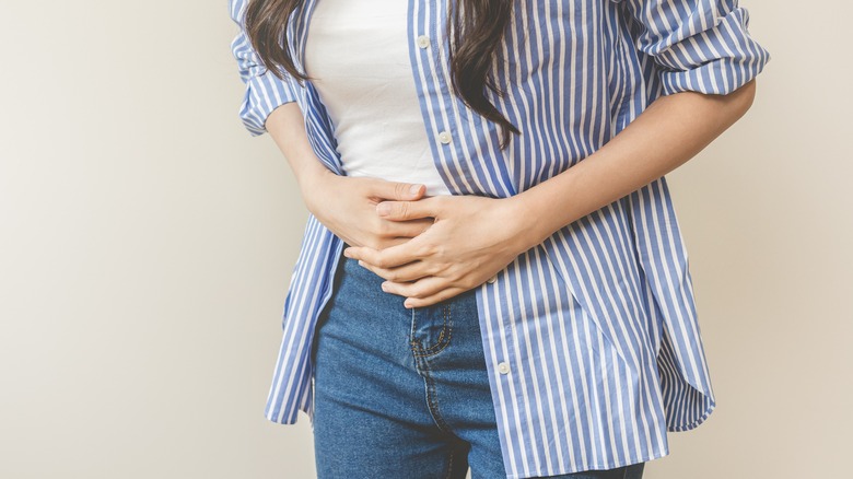 Person clutching stomach