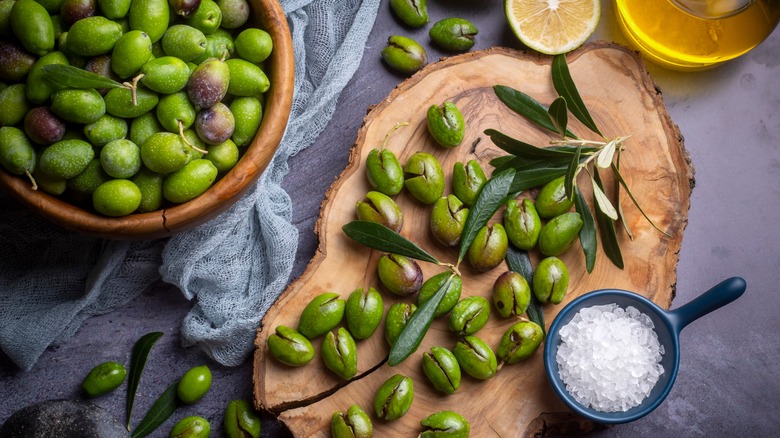 Fresh olives with salt, oil, and lemon