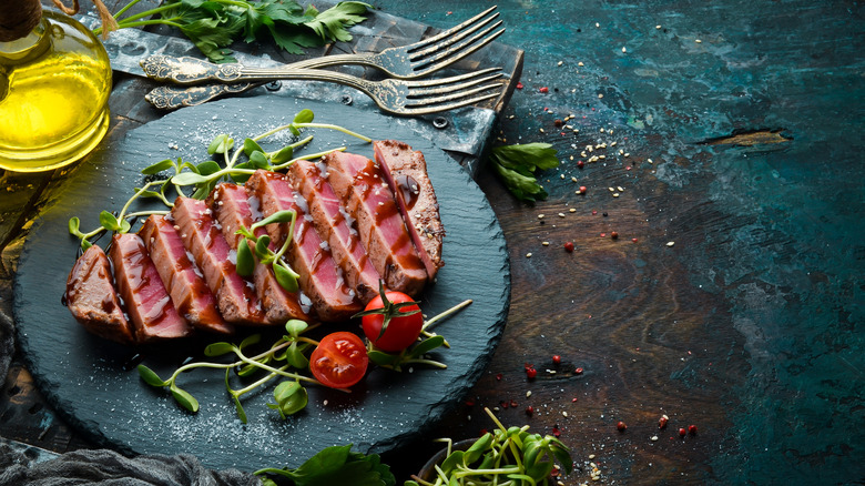 raw tuna dish with tomatoes and balsamic drizzle