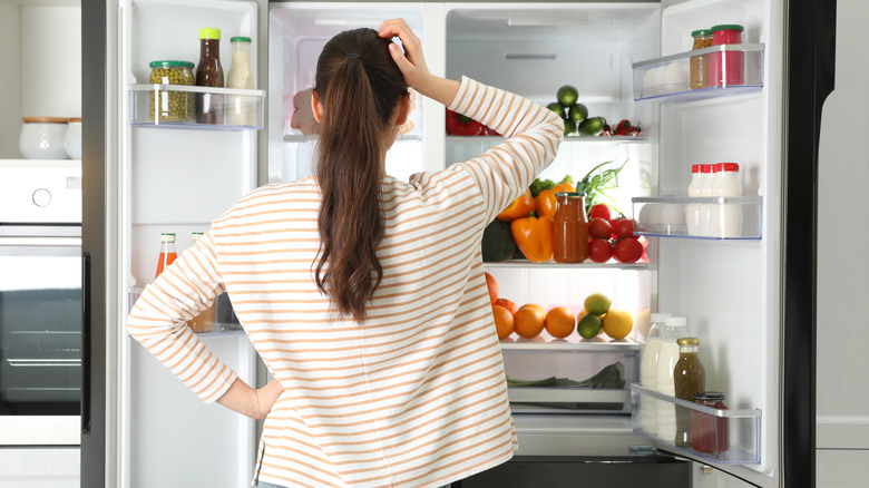 Person checking the refrigerator