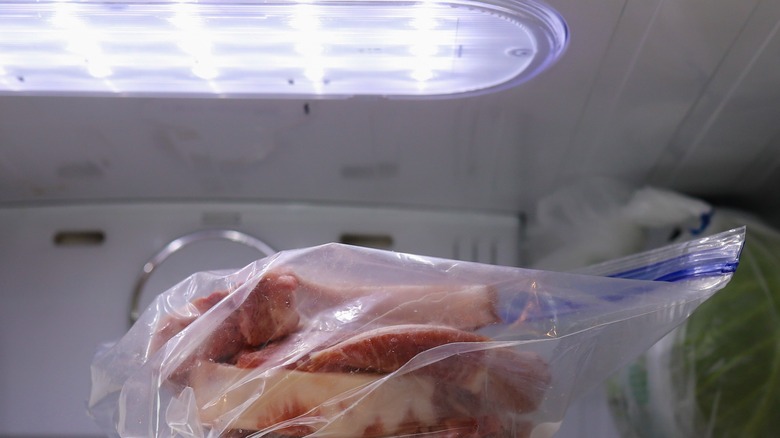 Pork chops thawing in refrigerator