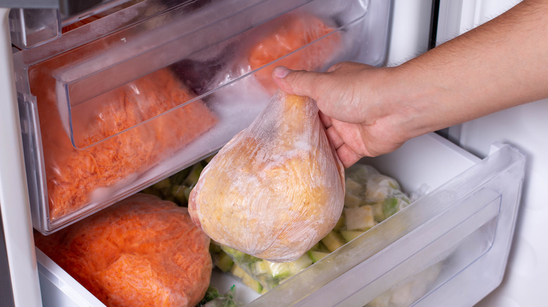 Pulling chicken from fridge