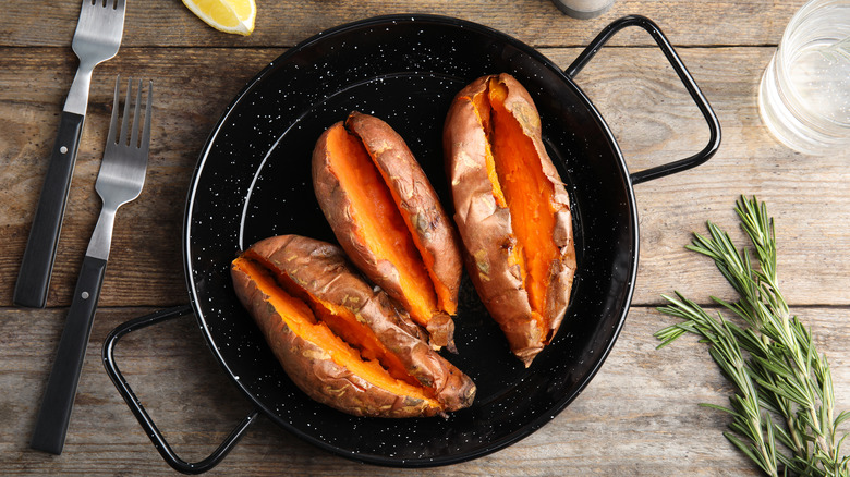 open sweet potatoes with forks