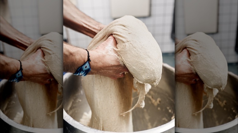 baker kneading dough