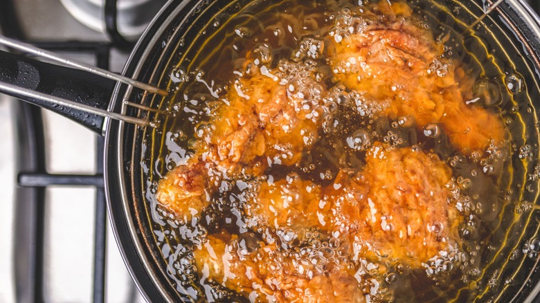 Overview of fried chicken frying in oil