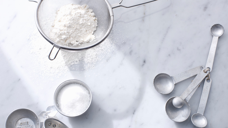 powdered sugar and measuring cups