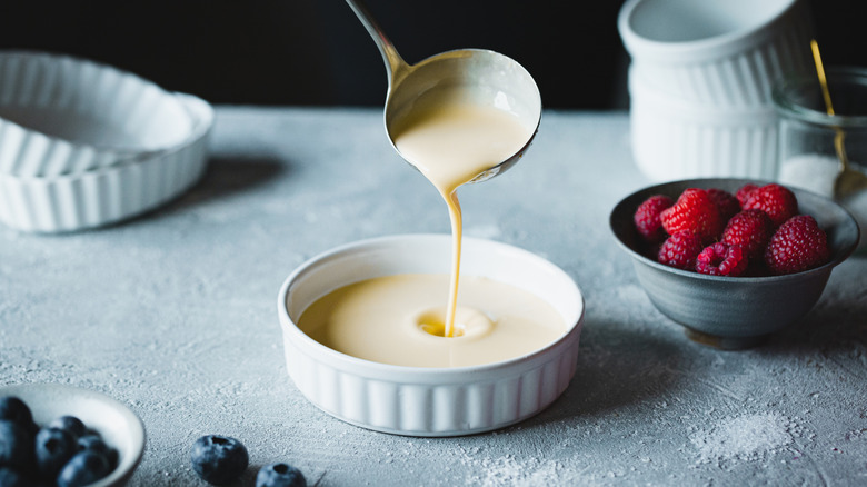 Ladle of fresh custard