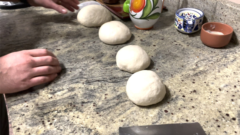 Four portioned dough balls 