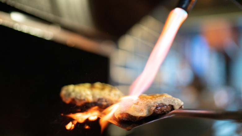 torching cheeseburger grill