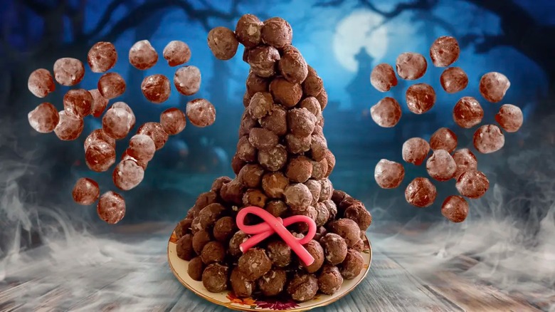 Donut holes stacked into witch hat