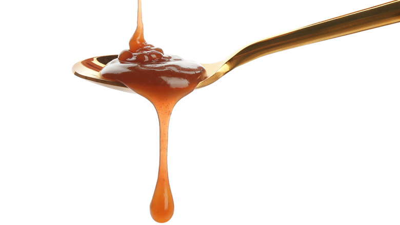 Caramel syrup on spoon