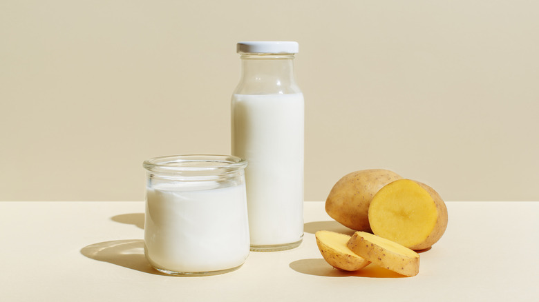 bottle and glass of potato milk