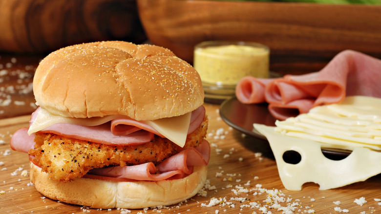 chicken cordon bleu sandwich on cutting board