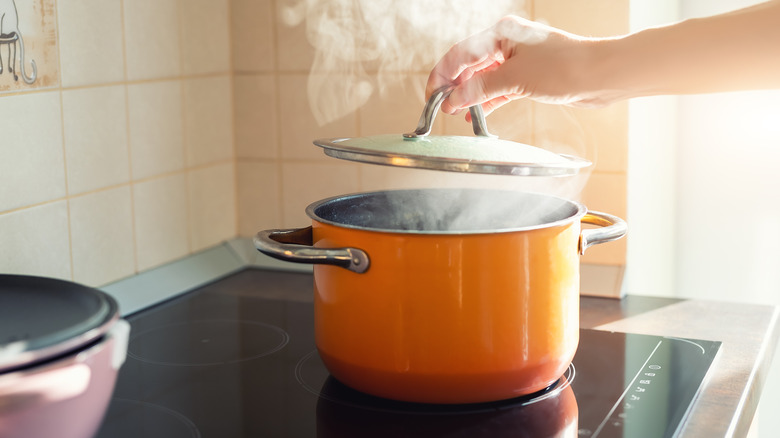 orange pot on stove 