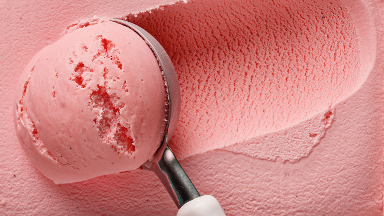 strawberry ice cream being scooped