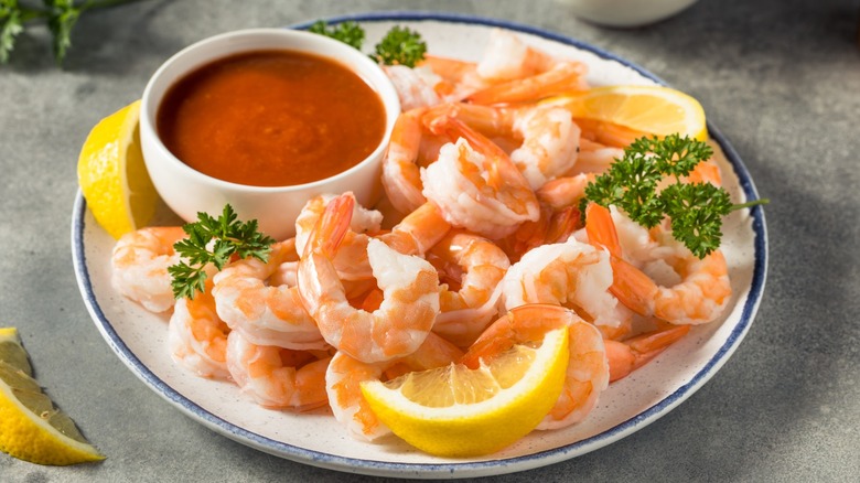 shrimp with cocktail sauce on plate