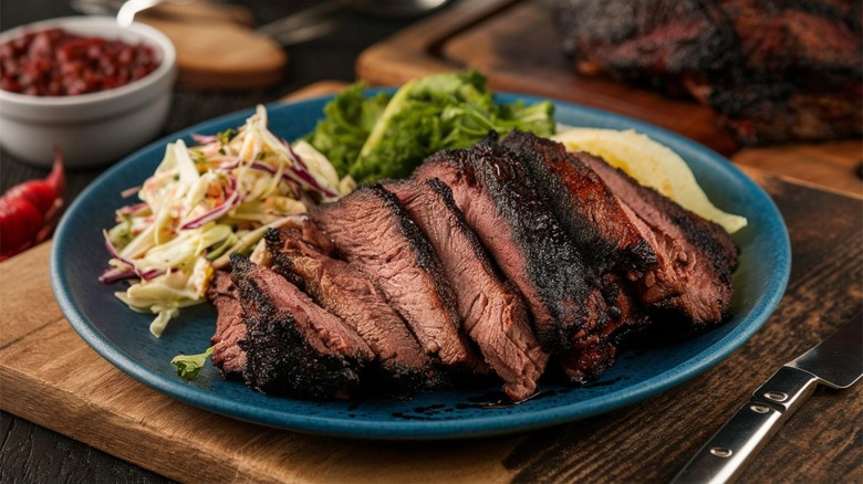 plate of sliced brisket with sides