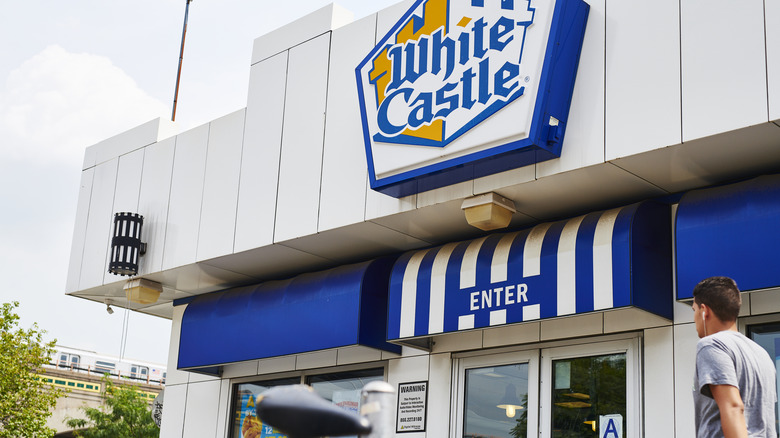 Plain and cheeseburger slider and fries in White Castle packaging