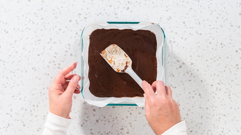 Smoothing fudge in parchment 