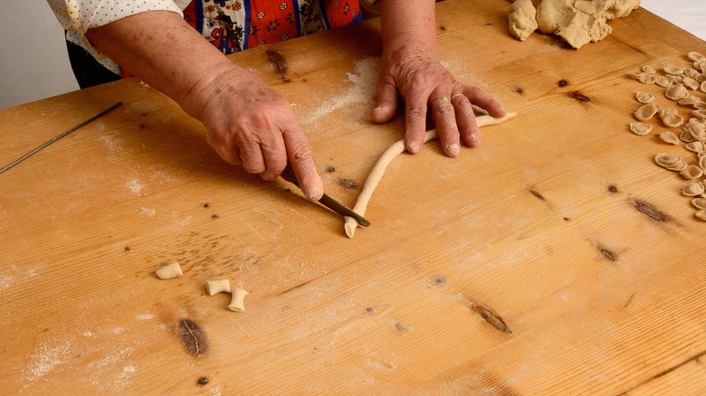 Rolling out gnocchi wooden board