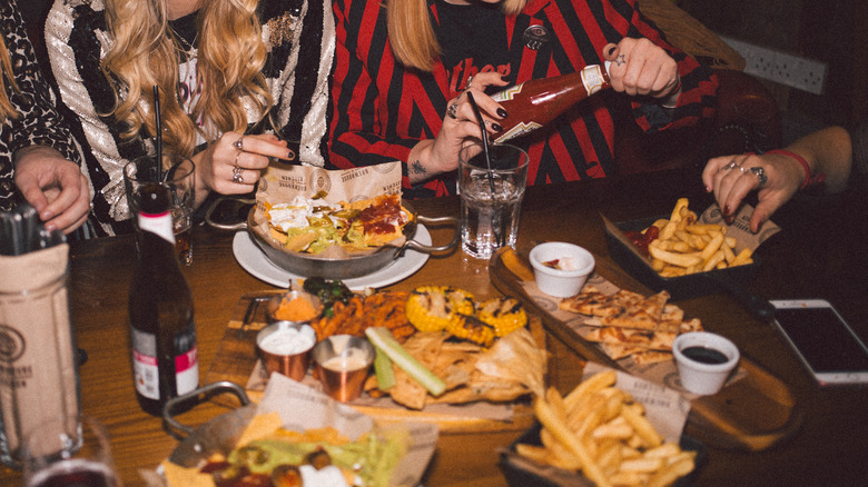 Friends around a table of food