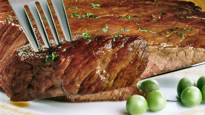 Closeup of steak and peas