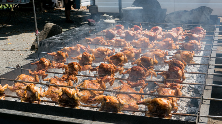 huli huli chicken cooking on the grill