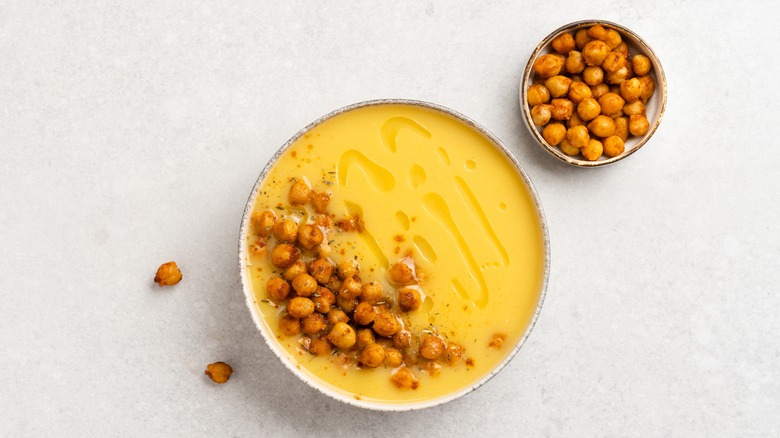 Yellow soup with roasted chickpea garnish