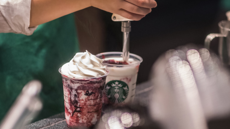 barista putting on whip