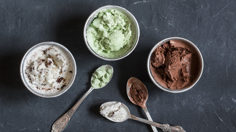 Ice cream in cups with spoons 