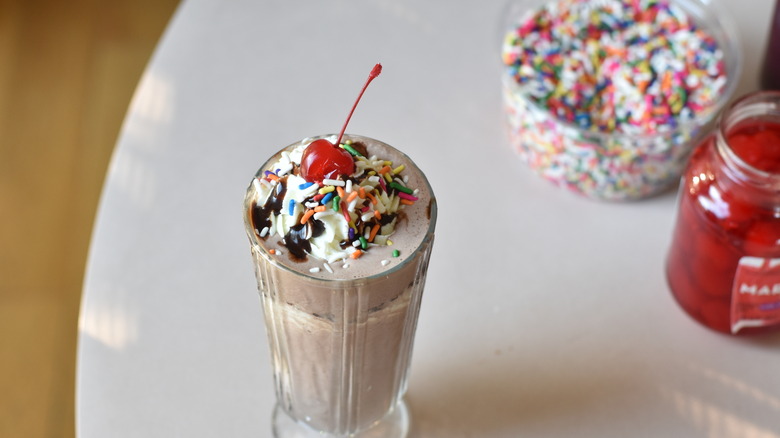 cherry and sprinkles chocolate milkshake