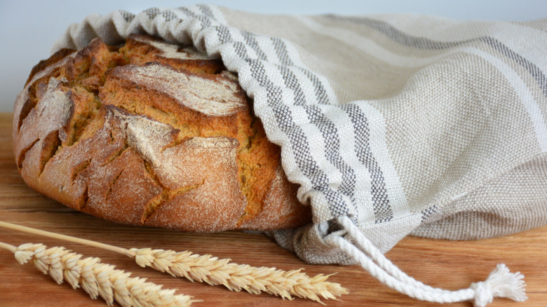 artisan loaf in linen bag