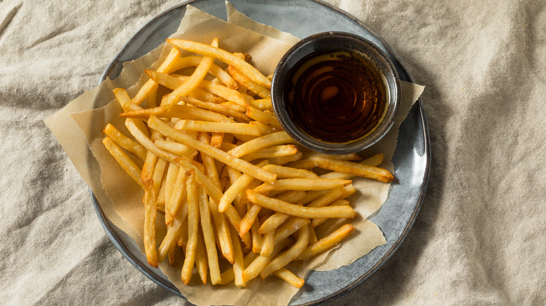 French fries with a cup of malt vinegar